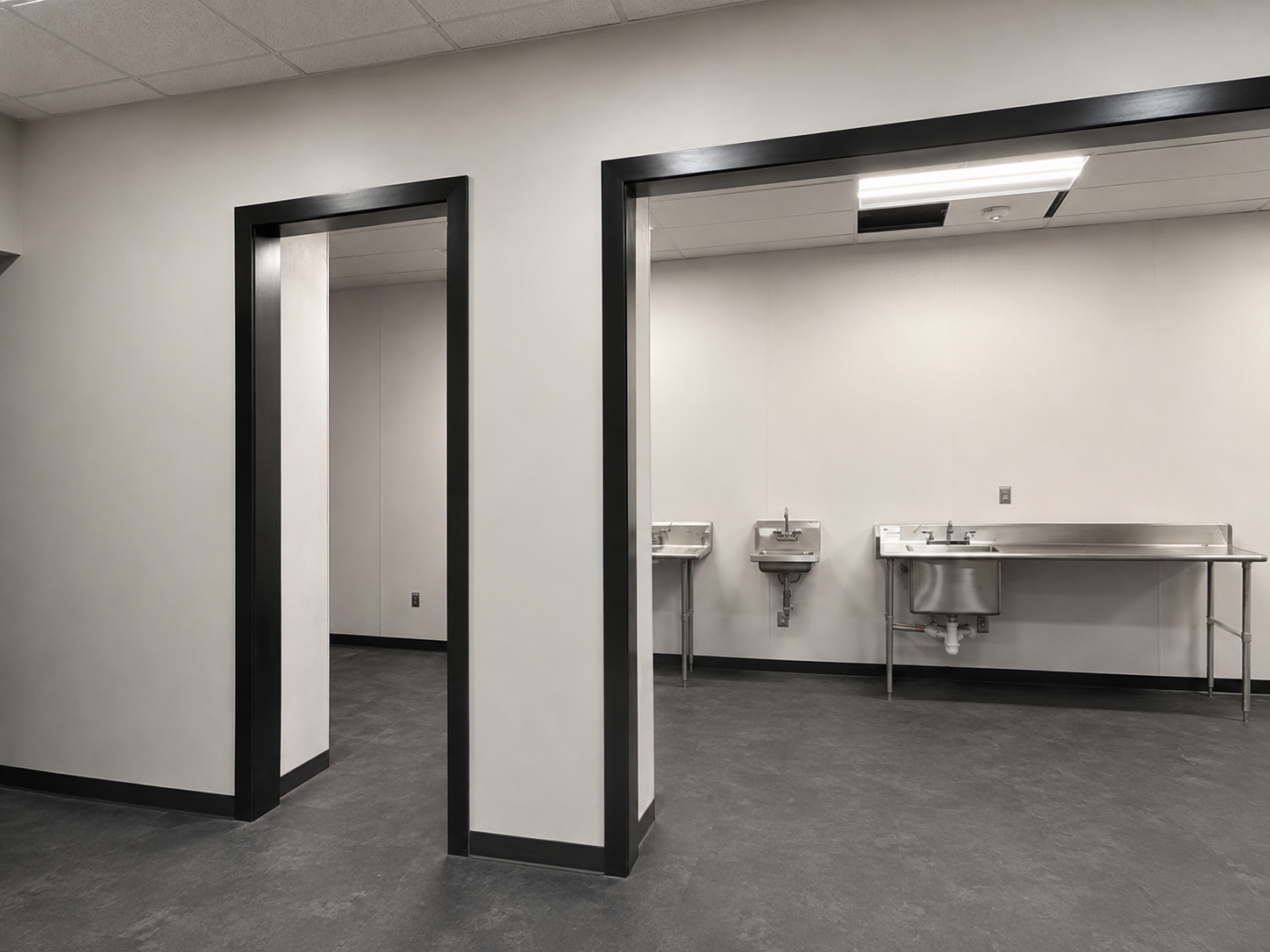 Sphere Glass Repair and Additions — finished black door trim and adjacent work area